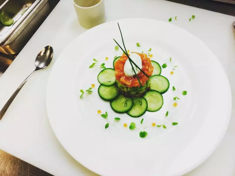 Fish（seasonal）tartare with avocado，corn blini and wasabi creme fraiche